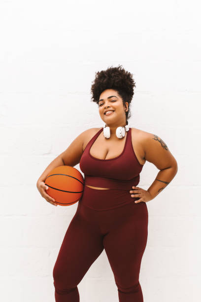 istock Plus size woman with basket ball 1331242354