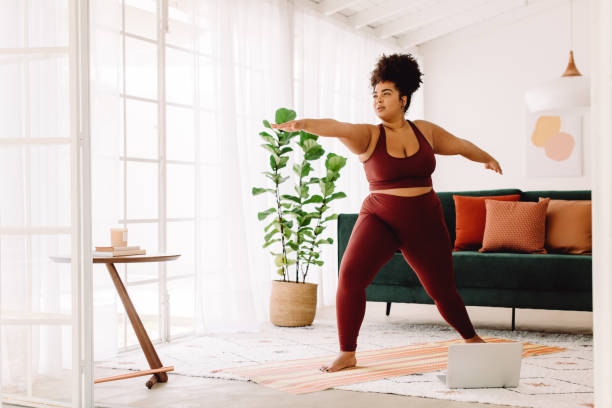 istock Healthy woman doing online workout 1331242360