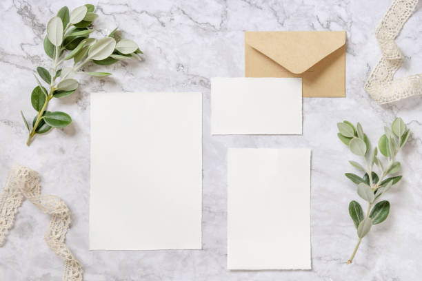 istock Wedding blank cards laying on a marble table decorated with eucalyptus branches 1331243261
