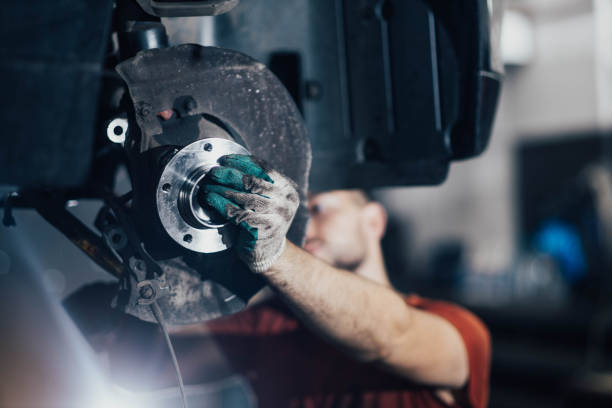 istock man changes a wheel hub with a wheel bearing in a car 1331243279