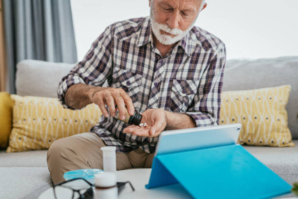 istock Senior man having medical check up with doctor over internet 1331243673