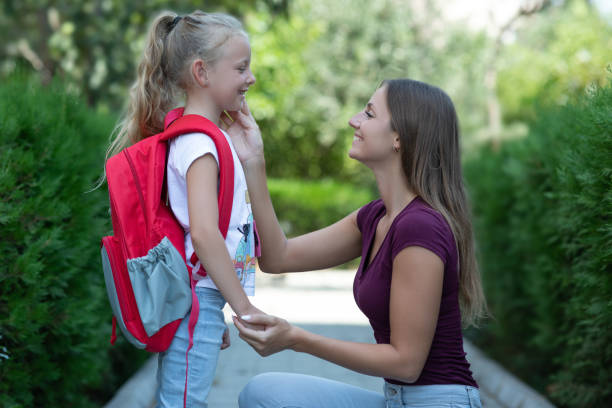 istock Mother talking with daughter before school 1331244266