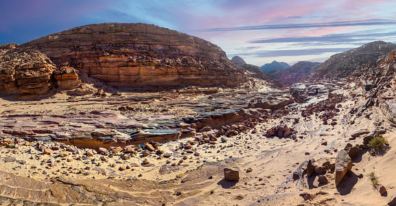 Colored Canyon on South of Sinai Peninsula on Egypt with a amazing stone desert and mountain landscapes at sunset. Panoramic view of the Taba region and multi colored sandstone rocks in Taba region.