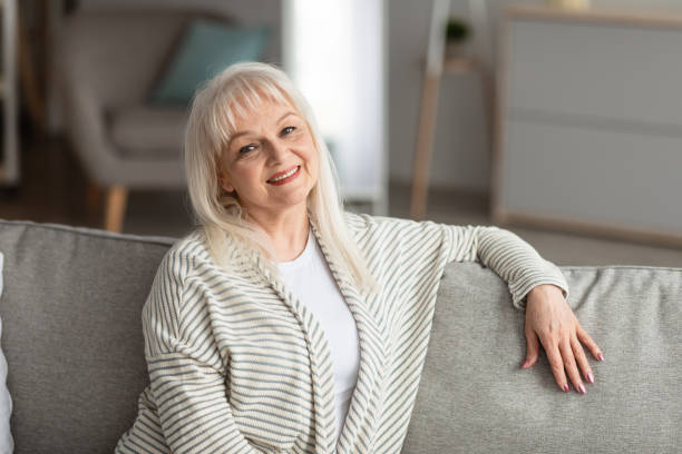 istock Mature woman having rest at home, posing at camera 1331246639