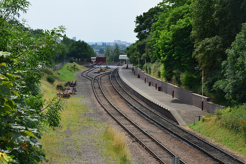 Platform at Aberdour Station, Fife, Scotland with the waiting room area and part of the station garden.