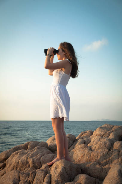 istock Girl using binoculars in the sea 1331249262