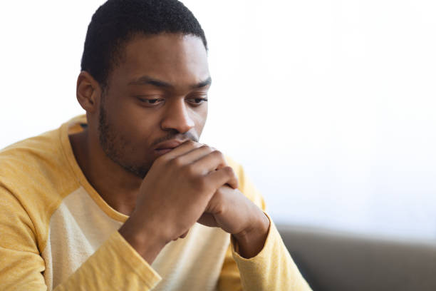 istock Pensive african american man thinking about something 1331251402