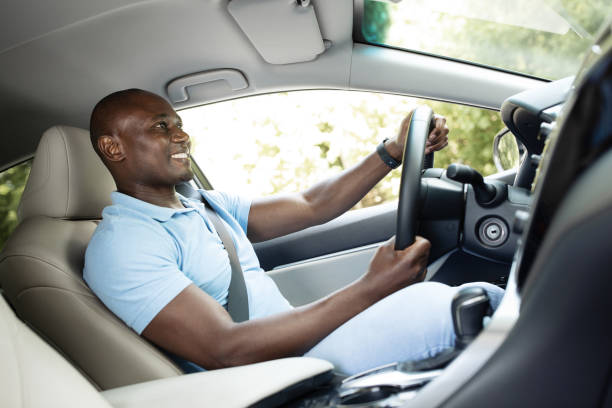istock Joyful black man enjoying his new luxury car 1331252835