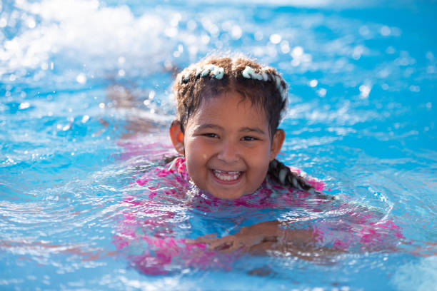 istock Child girl swimming. 1331253250