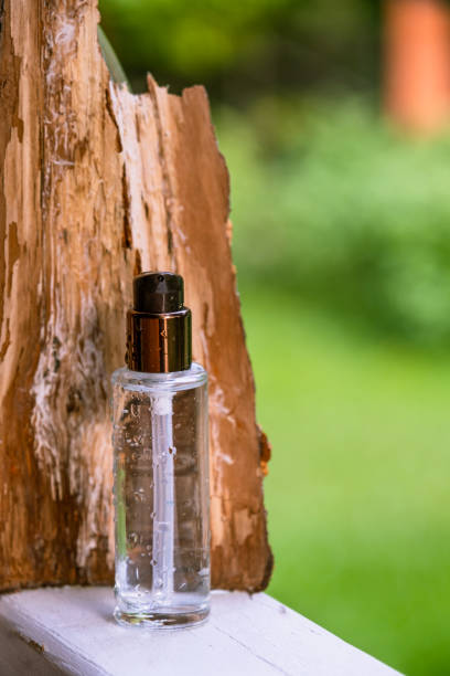 istock A transparent bottle with a cosmetic product in a composition with bark 1331254559