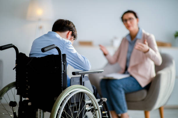 istock Psychological help for disabled people. Handicapped adolescent crying during consultation with psychotherapist at office 1331255526