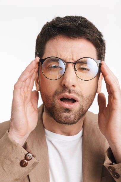 istock Image of successful man 30s with stubble wearing jacket and eyeglasses posing on camera 1331258163