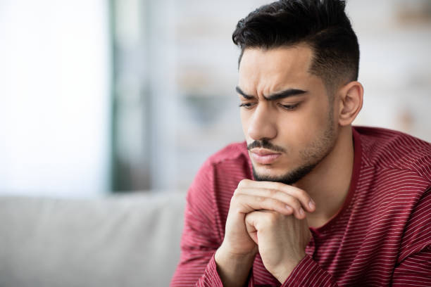 istock Closeup portrait of stressed arab guy having troubles, copy space 1331259193