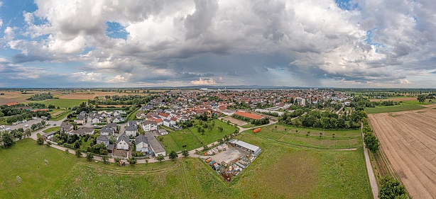 Drone panorama over the village Biebesheim in the Hessian district Gross-Gerau during daytime