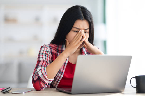 istock Stressed Asian Freelancer Woman Looking At Laptop Screen With Worry 1331259496