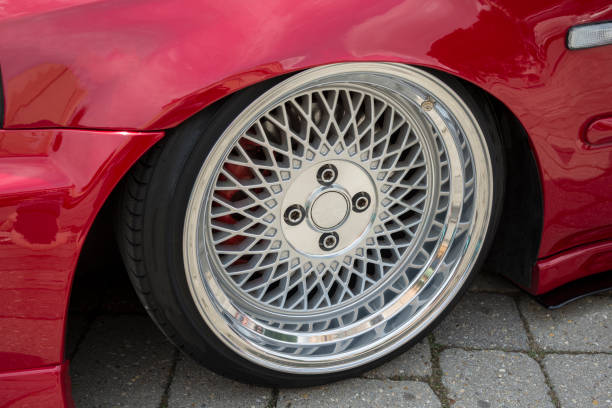 istock Modern car wheel with a light alloy disc. Low chassis. 1331260903