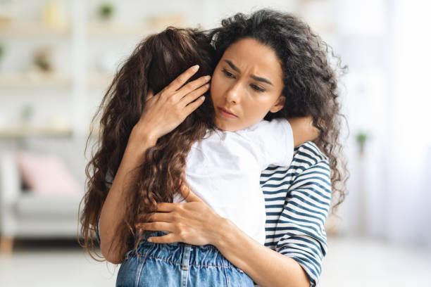 istock Loving mother hugging her crying little daughter 1331261130