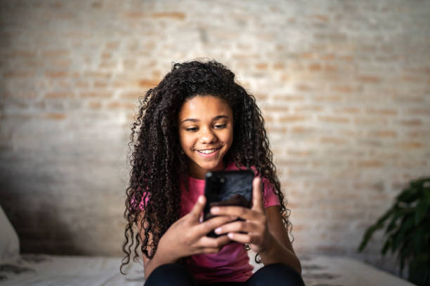istock Girl texting on smartphone at home 1331262120