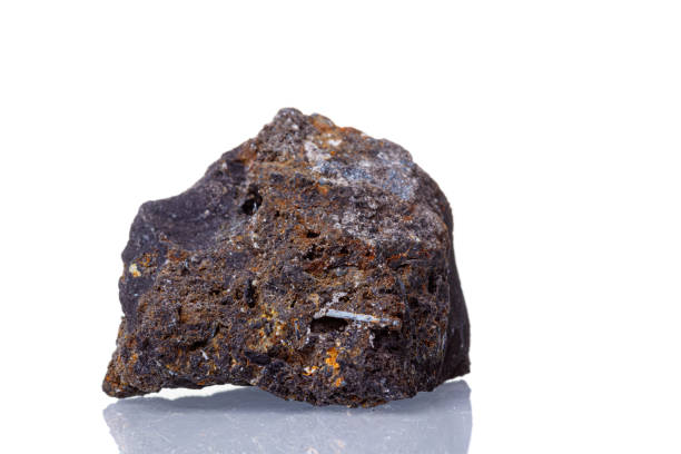 istock macro mineral stone Ilmenite on a white background 1331263519