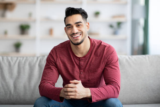 istock Handsome arab guy chilling at home, smiling at camera 1331263746