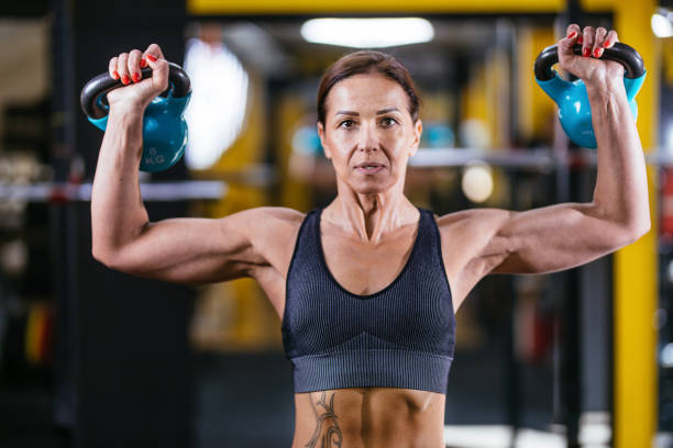 istock Determined mature athlete working on her shoulders and good posture 1331263845