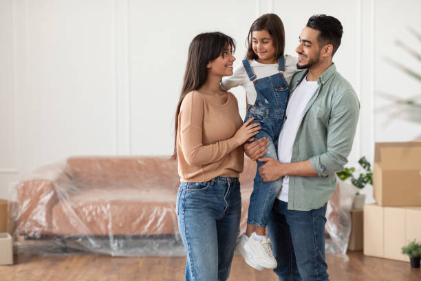 istock Happy family looking at each other, posing in new flat 1331264992