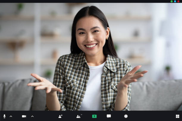 istock Cheerful asian lady attending video conference, pov screen, copy space 1331266761