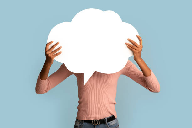 istock Black Woman Holding Blank Empty Speech Bubble In Front Of Her Face 1331266819
