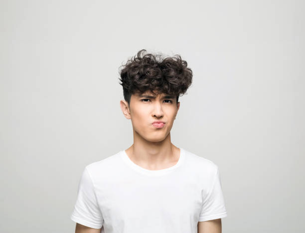 istock Headshot of confused young man 1331266875