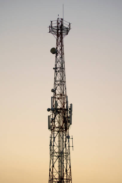 istock Silhouette of Communications tower with sunset sky background 1331267938