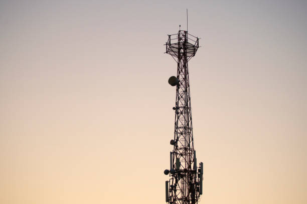 istock Silhouette of Communications tower with sunset sky background 1331267954