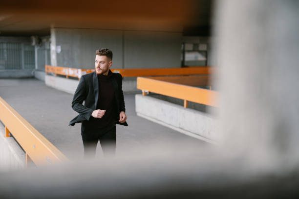 istock Handsome young business person walking on the bridge 1331271777
