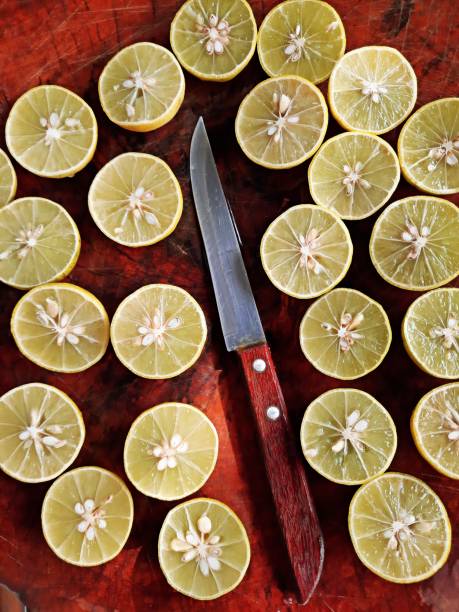 Cutting lemons on cutting board.