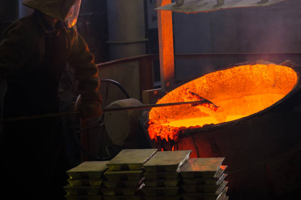 istock a caster at work at a molten vat with red metal, hard work in hot production 1331272476