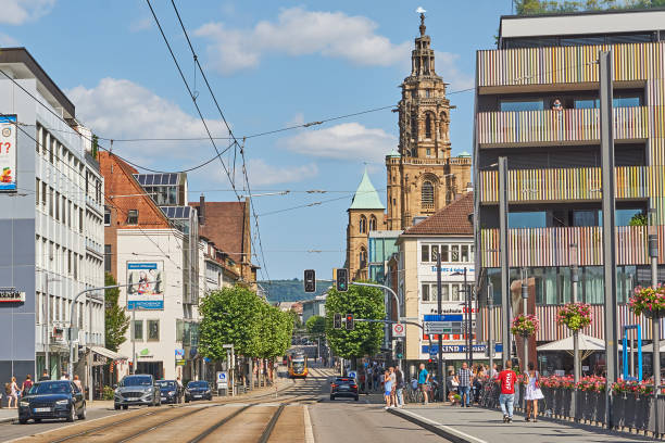 Heilbronn Heilbronn, Germany - July 17, 2021: Pedestrians and traffic on the Friedrich Ebert Bridge in the center of Heilbronn. The tower of Kilian's Cathedral can be seen in the background. heilbronn stock pictures, royalty-free photos & images