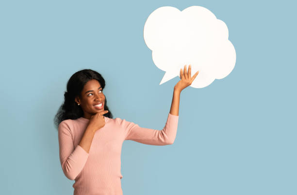 istock Idea. Pensive Black Lady Looking At Blank Speech Bubble And Touching Chin 1331273532