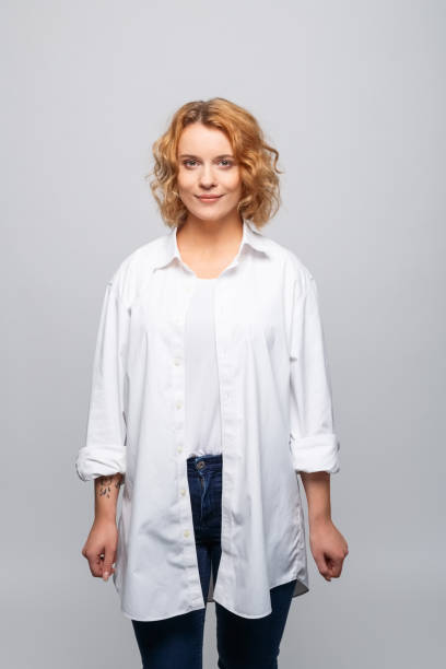 istock Friendly young woman in white shirt 1331274729