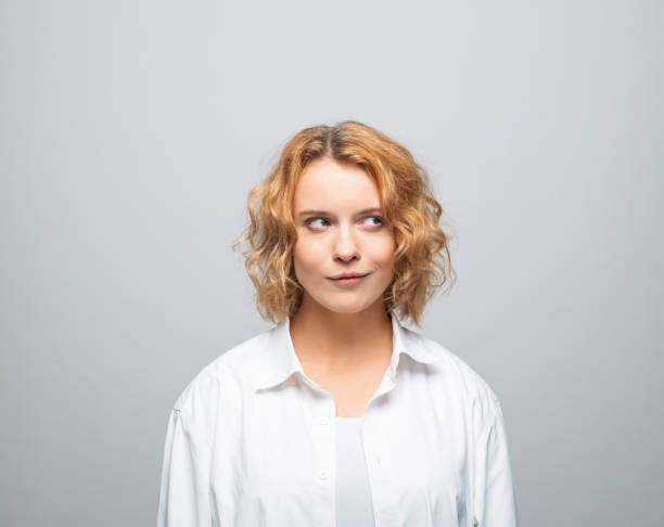 istock Thoughtful young woman in white shirt 1331274879