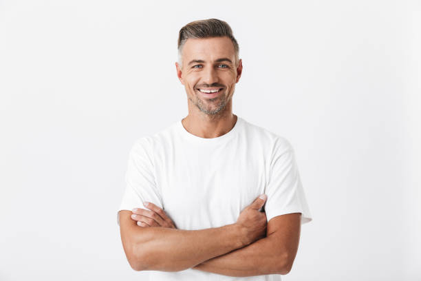 Confident handsome shirtless man standing isolated