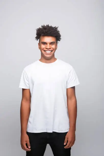Photo of Friendly young man in white t-shirt