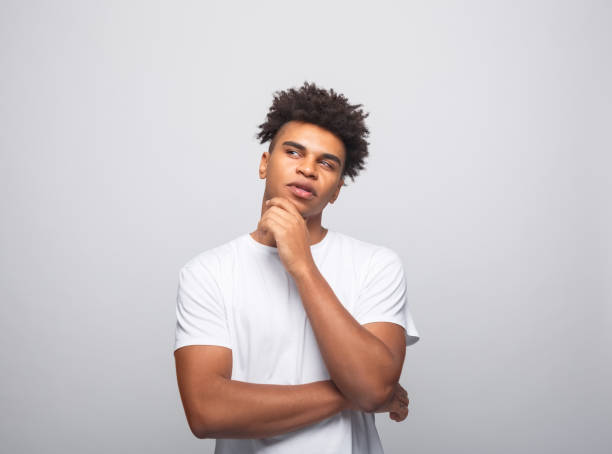 istock Thoughtful young man in white t-shirt 1331279113