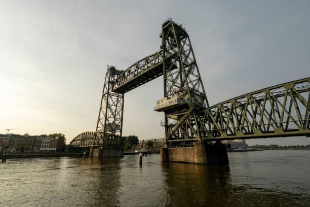 istock Opened olive green, steel elevator bridge over a canal on a beautiful day 1331280501