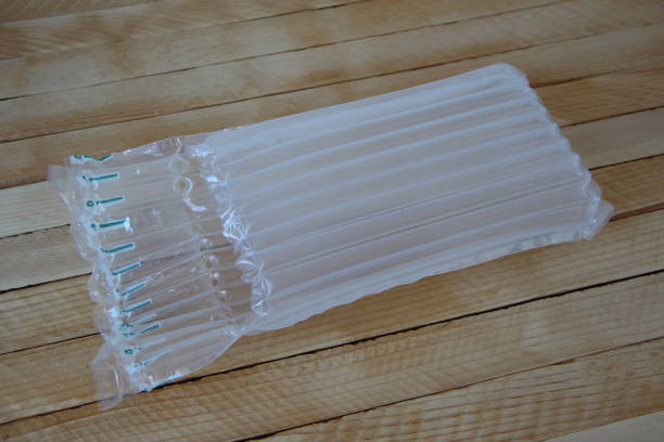istock Plastic inflatable air shockproof packaging on a wooden background 1331282180