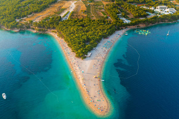 Aerial scene of Zlatni rat beach on Brač island, Croatia Aerial scene of Zlatni rat beach on Brač island, Croatia brac island stock pictures, royalty-free photos & images