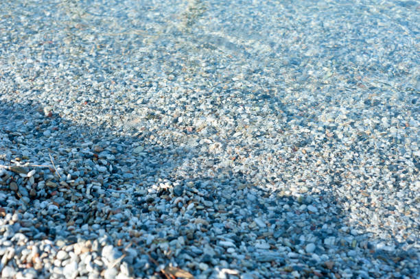 Pebbles, sea, coast, beach stock photo.