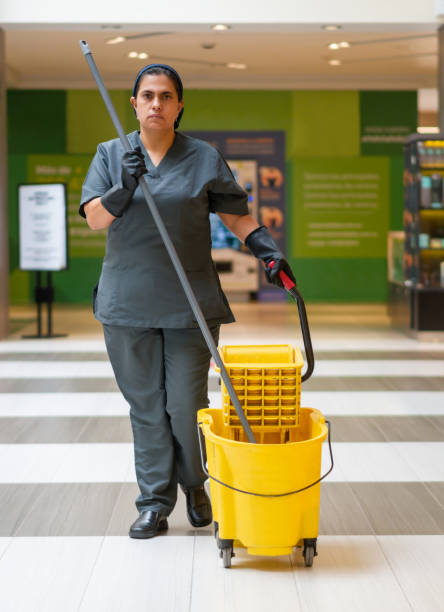 istock Cleaning lady mopping the floor at the mall 1331288367