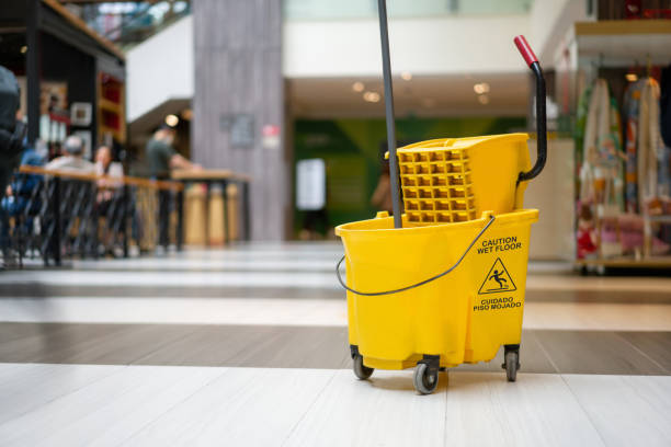Caution wet floor - yellow mopping cart at a shopping mall
