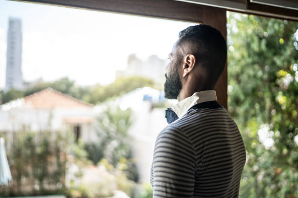 istock Mature man contemplating at home 1331290589