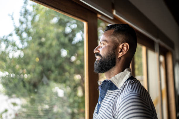 istock Mature man contemplating at home 1331290591