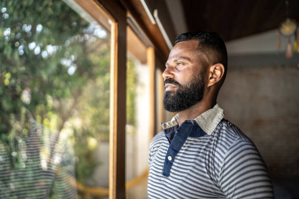 istock Mature man contemplating at home 1331290594